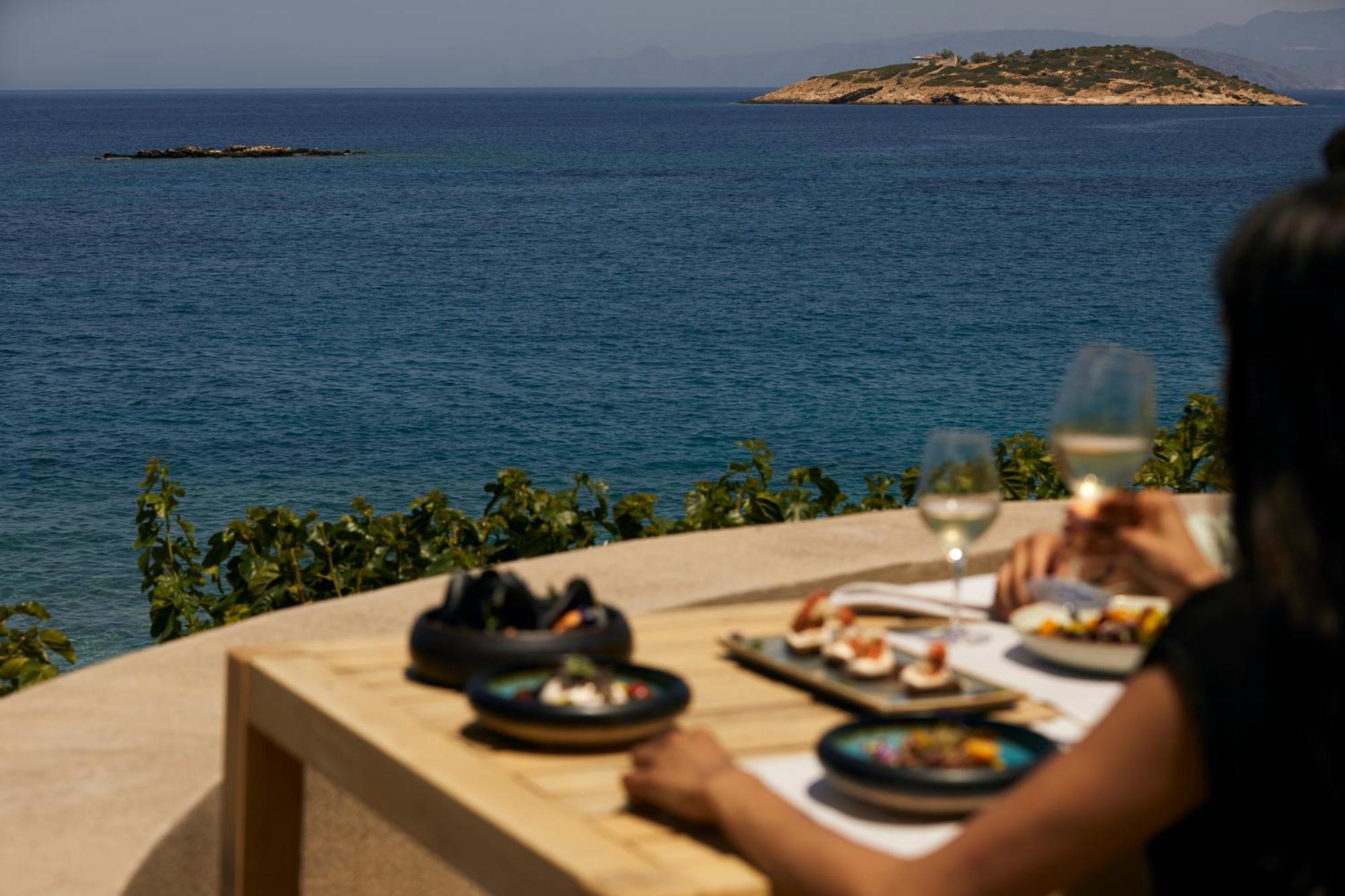 Minos Palace Resort - Adults Only Agios Nikolaos  Bagian luar foto A woman eating meze