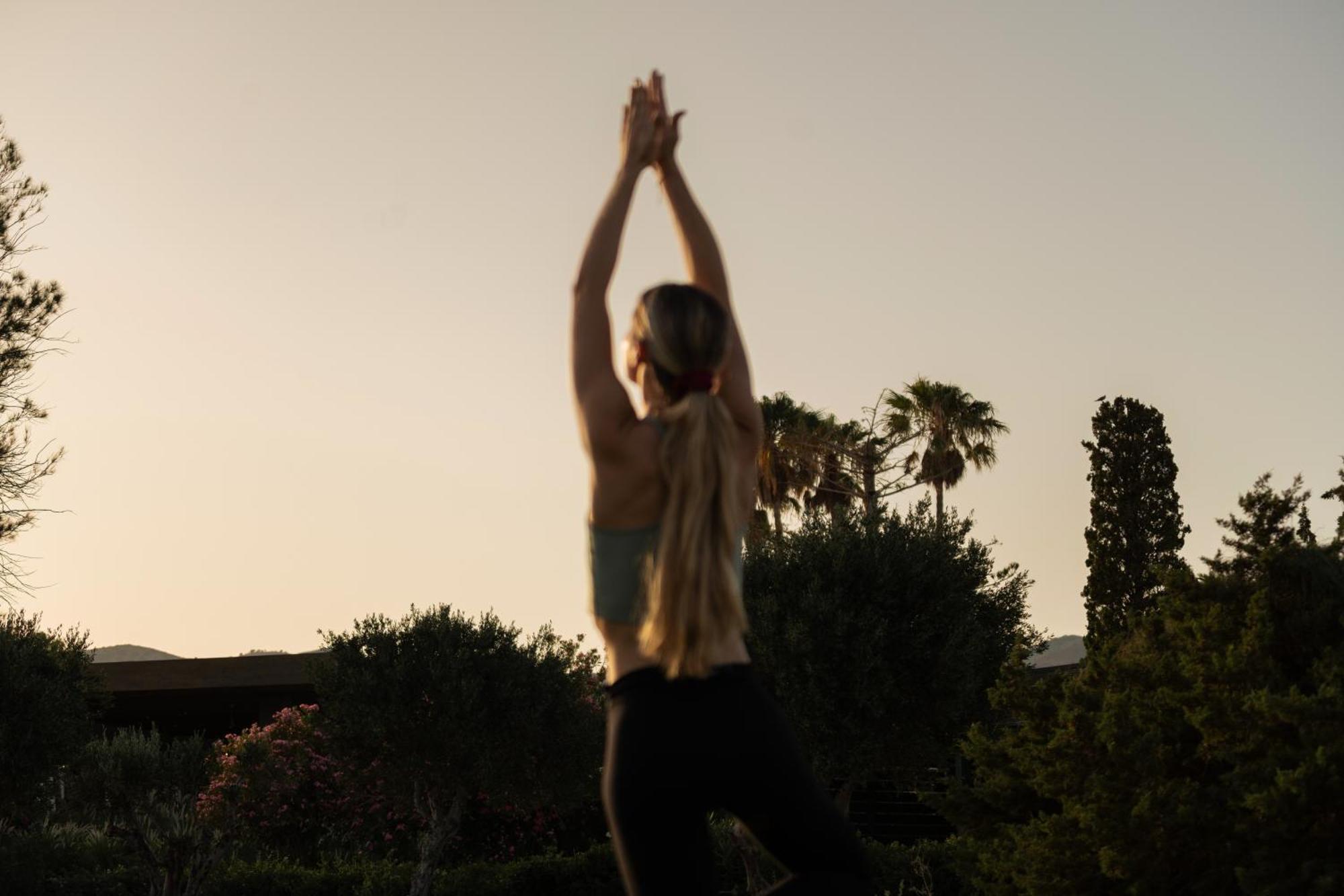 Minos Palace Resort - Adults Only Agios Nikolaos  Bagian luar foto A woman practicing yoga